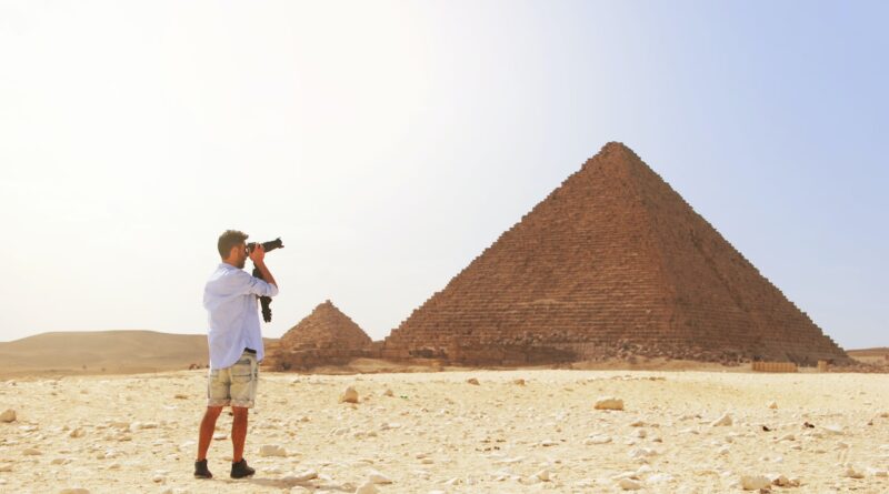 Man Taking Photo of the Great Pyramid