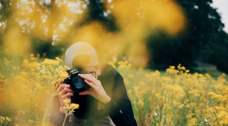 man using Nikon DSLR camera